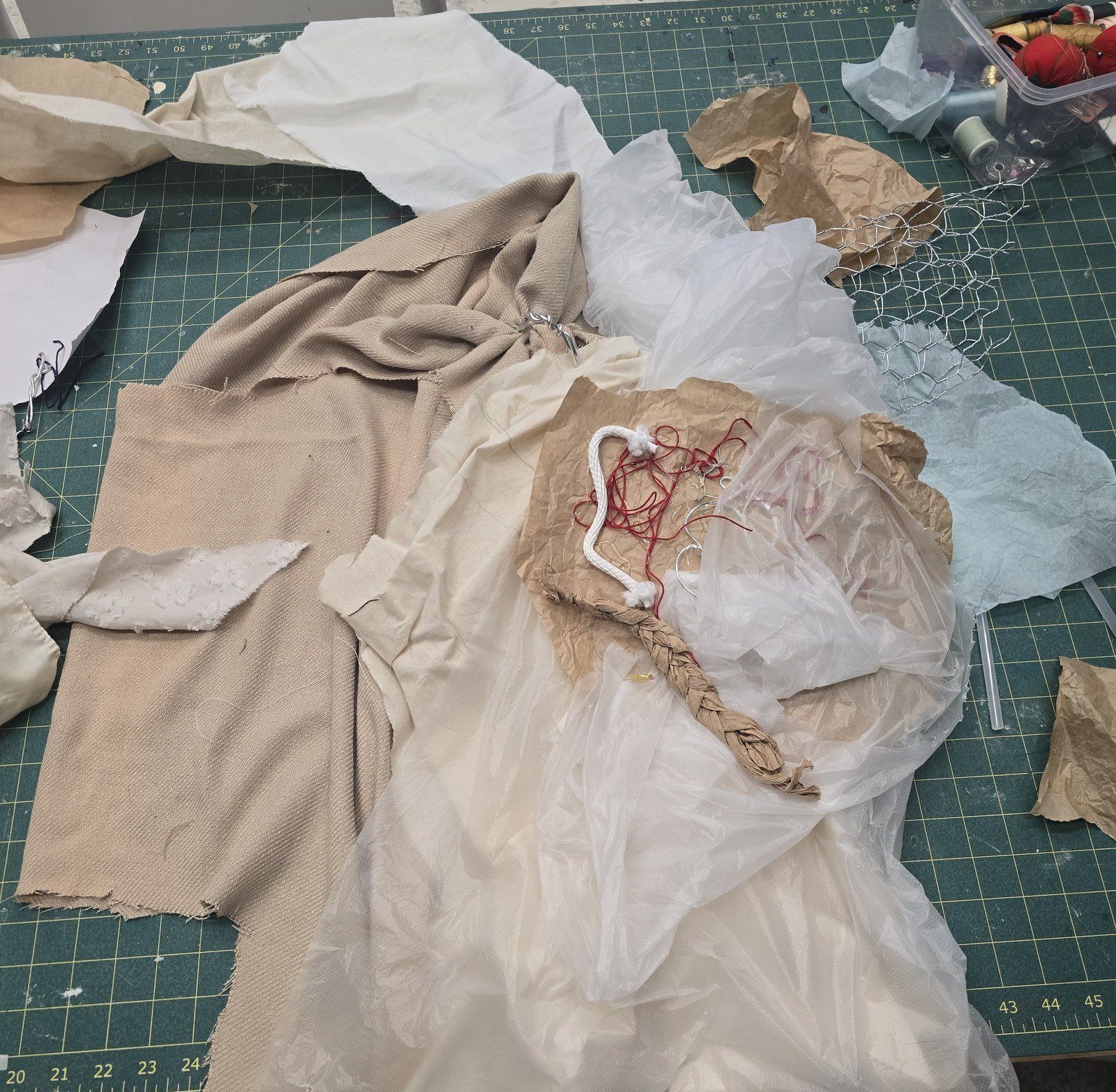 Mixed-material patches and red string assembled on the corset and skirt