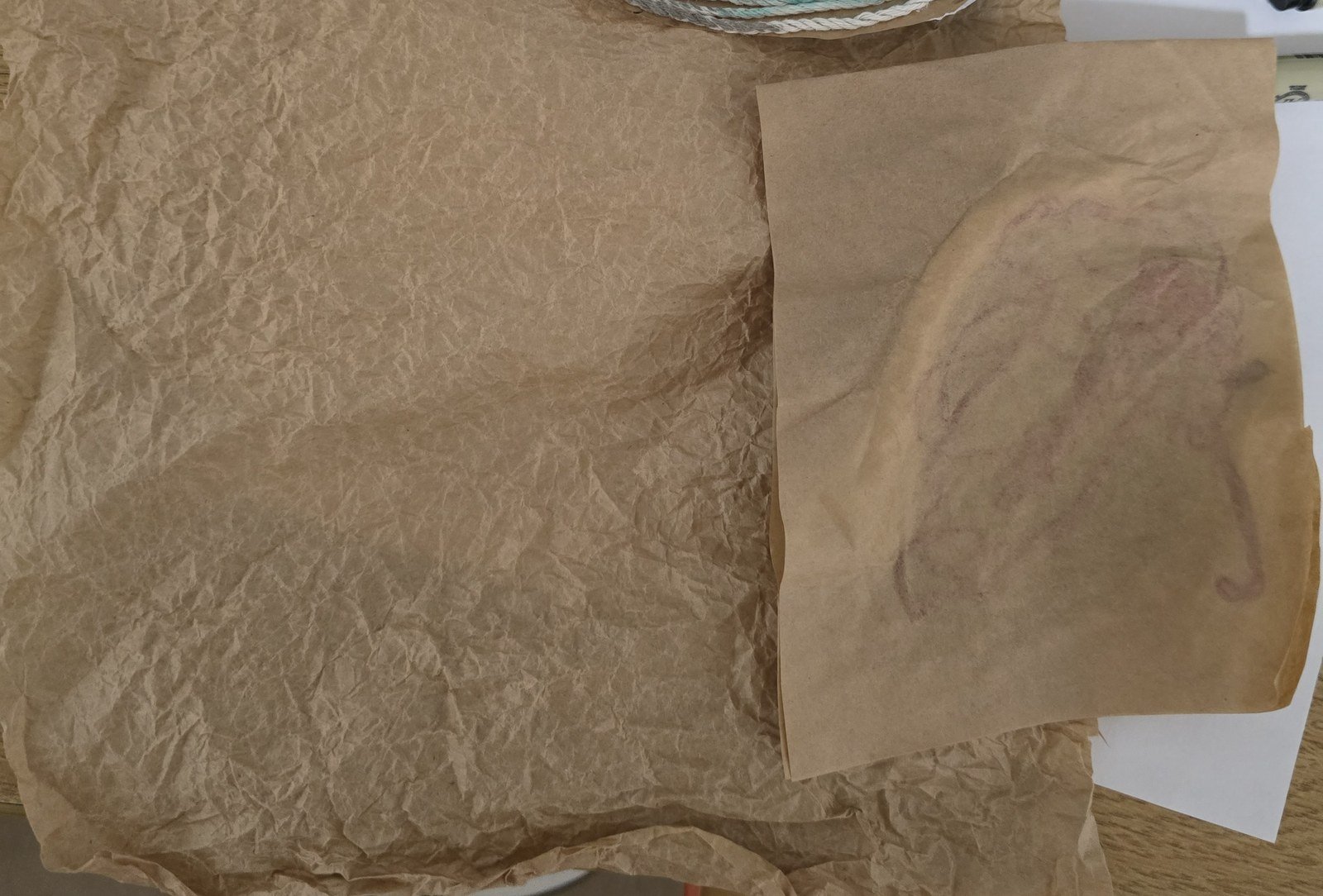 Tissue-paper trial, crumpled and unfolded to mimic skin texture
