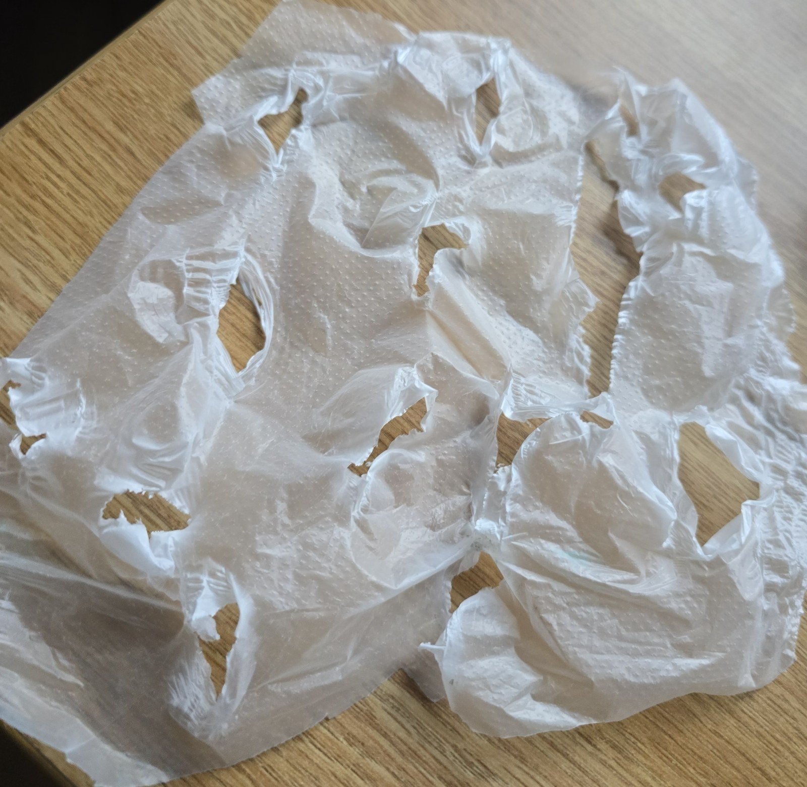 Torn plastic-wrap trial standing in for wounded skin