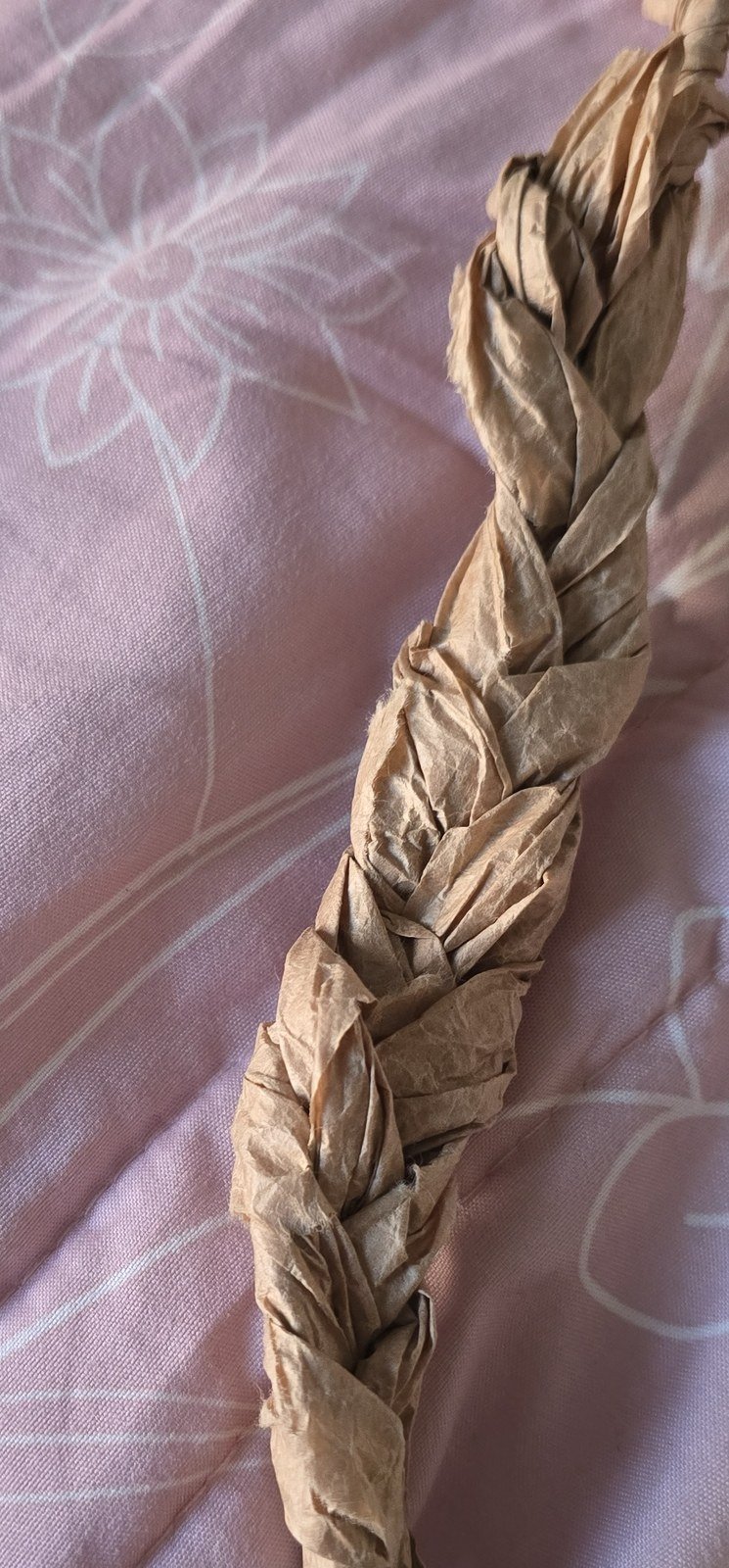 Unevenly braided paper symbolizing tangled emotions
